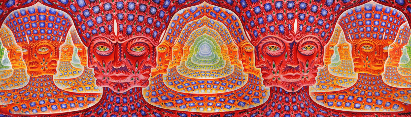A surreal, densely patterned artwork of repeating stylised faces and eyes, in warm reds and oranges with blue accents